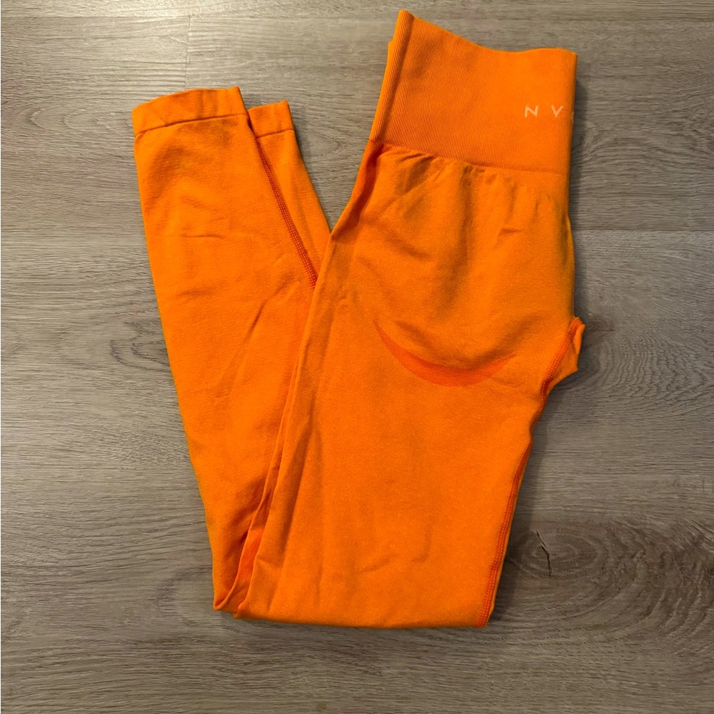 NVGTN orange leggings, size S